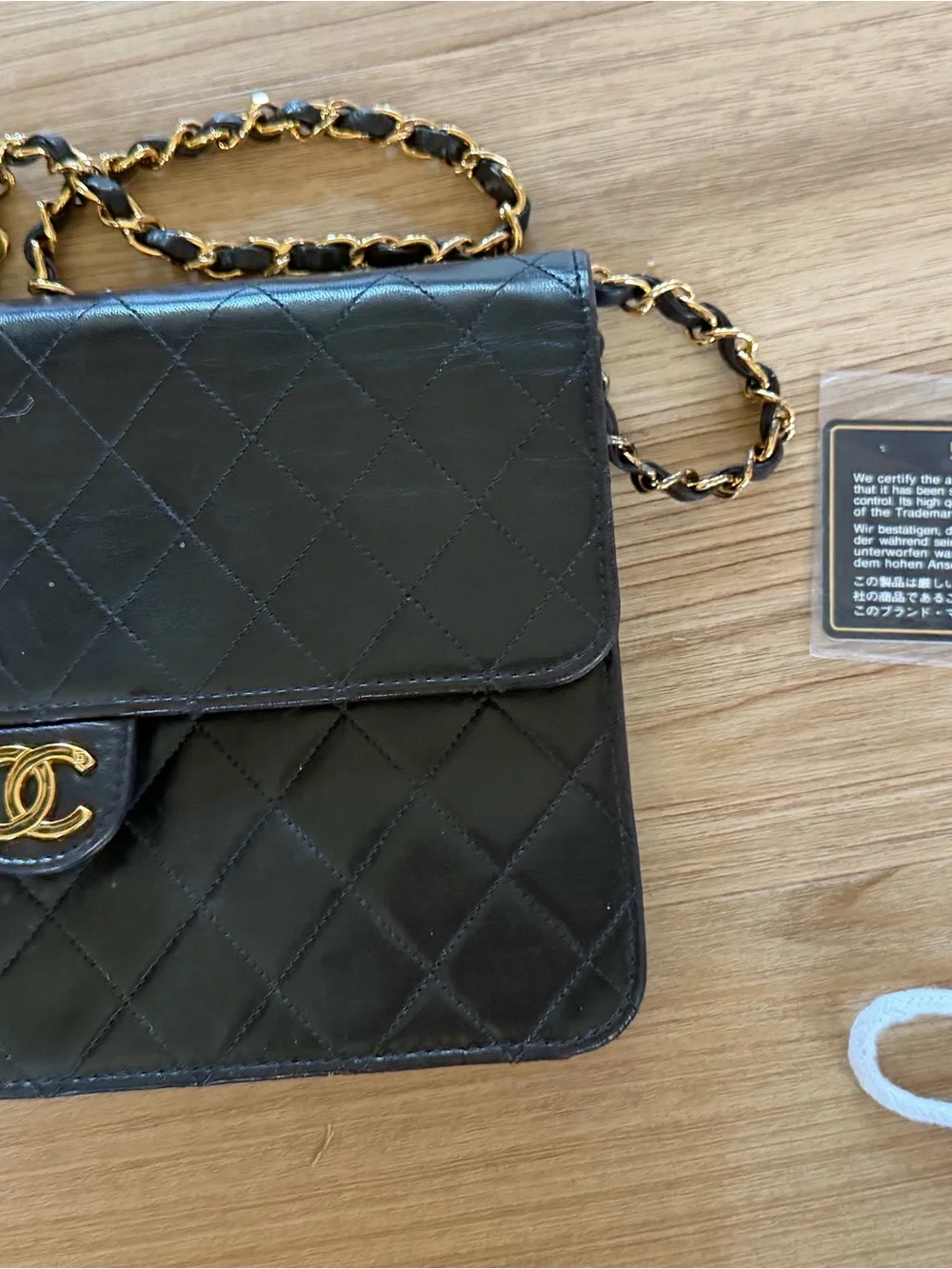 CHANEL Black Quilted Lambskin monoflap with Gold CC Emblem